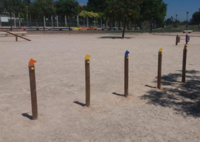 Dog park with weave poles.